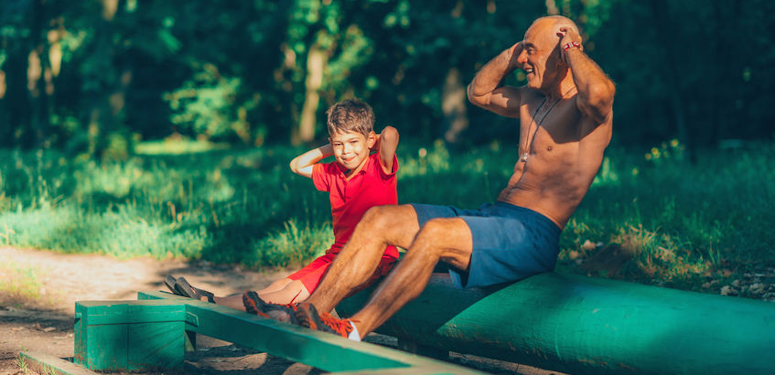 grandfather exercising with his grandson.